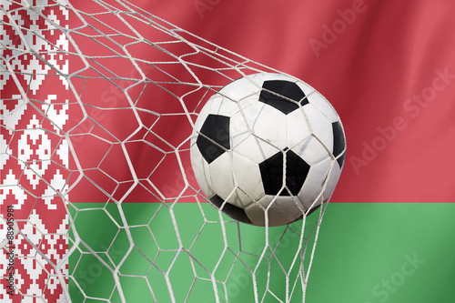Belarus flag and soccer ball, football in goal net