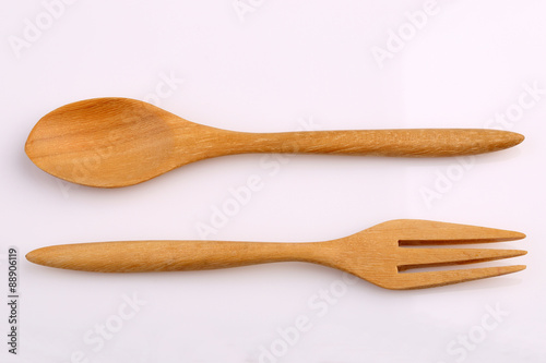 Wooden fork and wooden spoon made by Teak isolated on white back