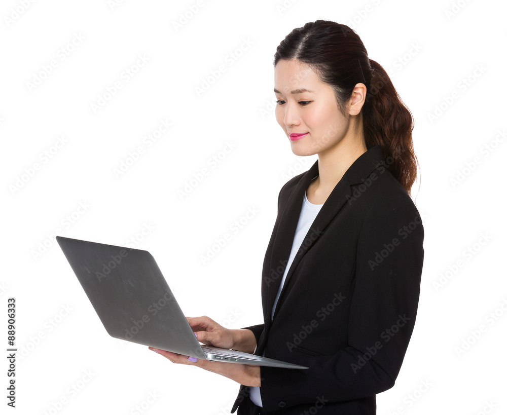 Asian businesswoman use of the notebook computer Asian businesswoman use of the notebook computer