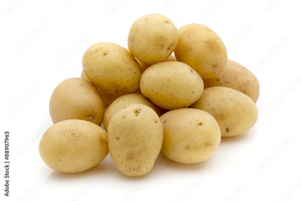 Potatoes on the white background. New harvest. Potatoes on the white background. New harvest.