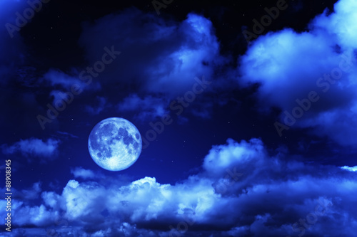 Night sky with a full moon and shining stars