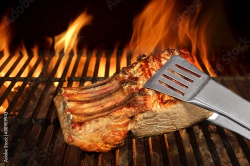 Big Chop Of Pork Ribs On The Flaming BBQ Grill