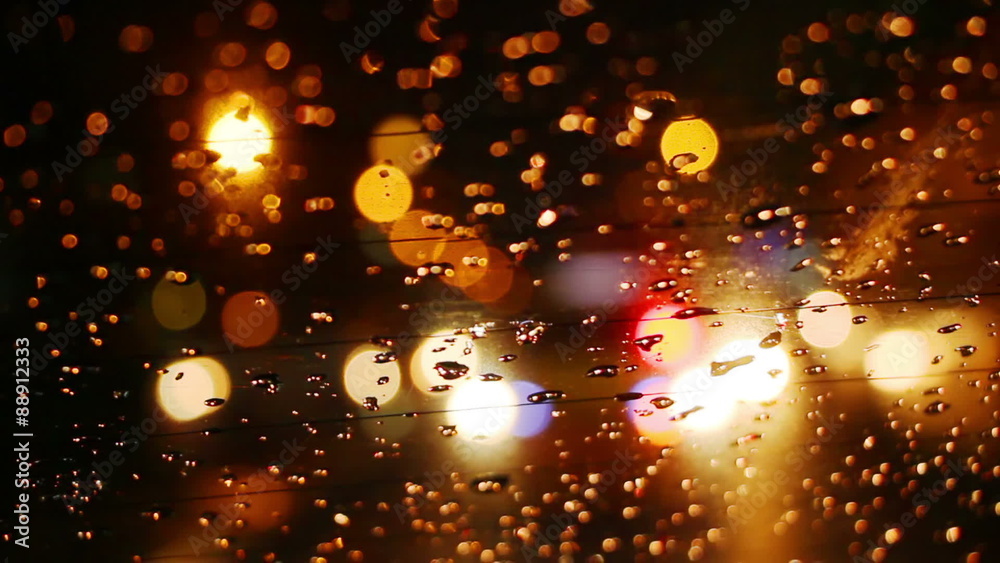 traffic bokeh lights in rainy night city

