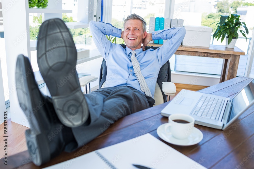 Businessman relaxing in a swivel chair Businessman relaxing in a swivel chair