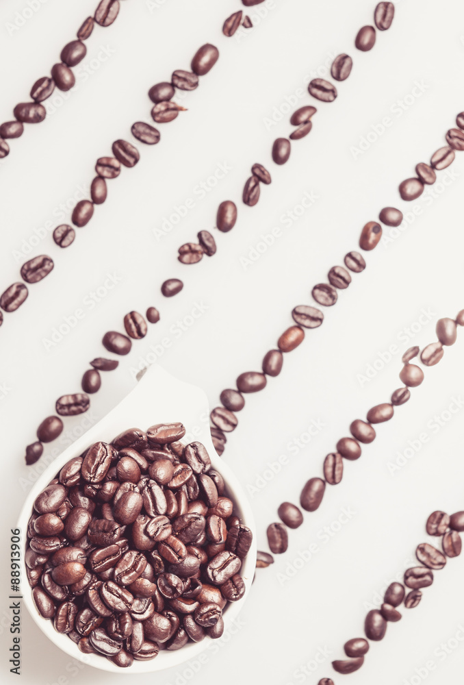 Coffee beans pattern with a coffee cup on top Coffee beans pattern with a coffee cup on top