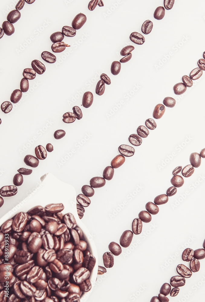 Coffee beans pattern with a coffee cup on top Coffee beans pattern with a coffee cup on top