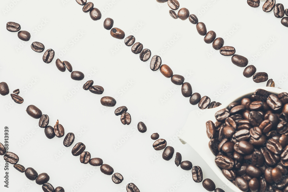 Coffee beans pattern with a coffee cup on top Coffee beans pattern with a coffee cup on top