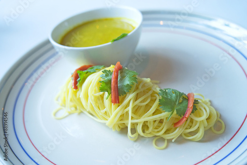 Yellow noodle on plate photo