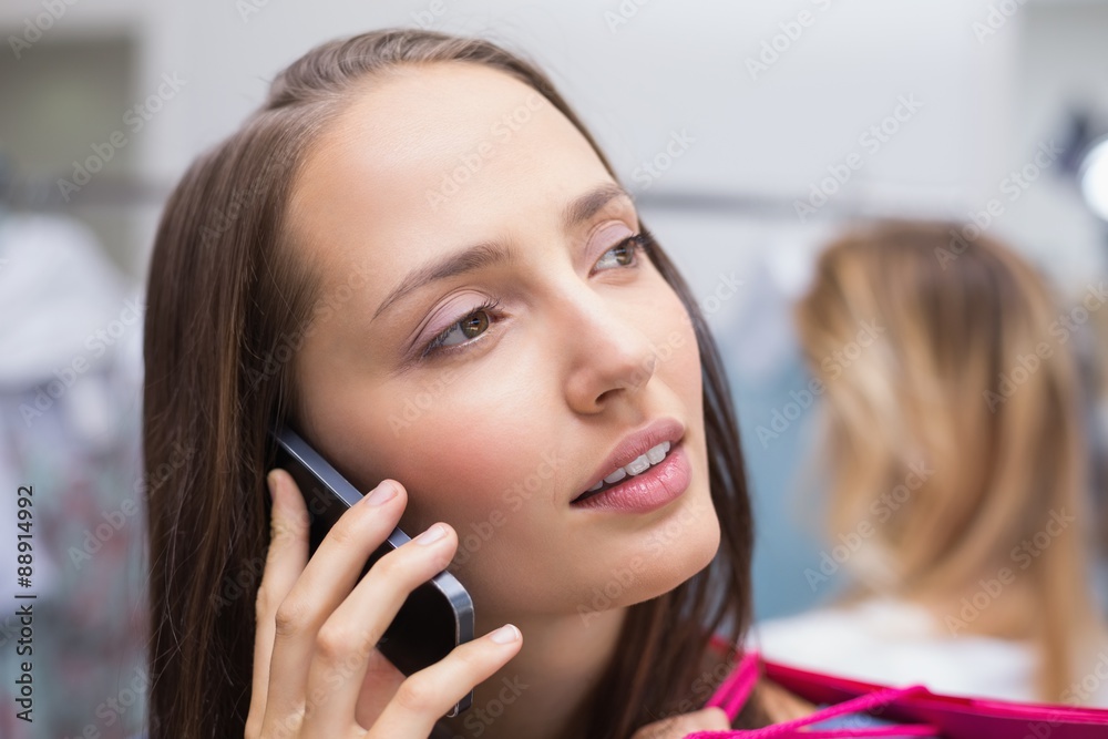 Pretty brunette talking on the phone Pretty brunette talking on the phone