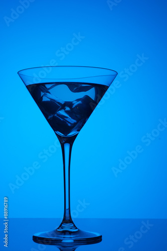 colourful coctail with ice on the blue background
