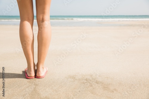 Woman standing on the sand