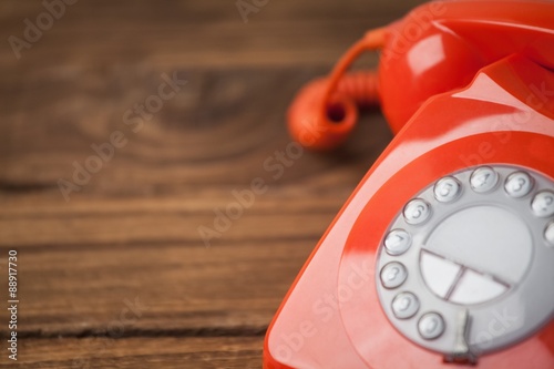 Bild auf Leinwand Red telephone on wooden table