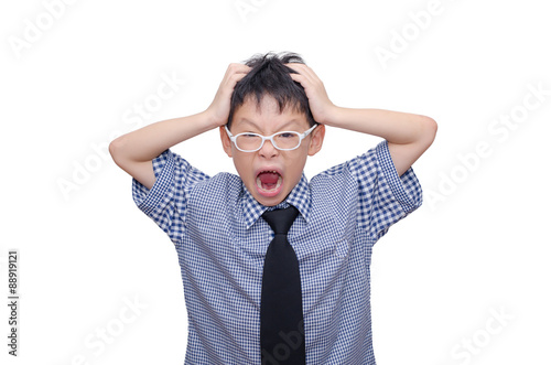 Asian schoolboy screaming over white background