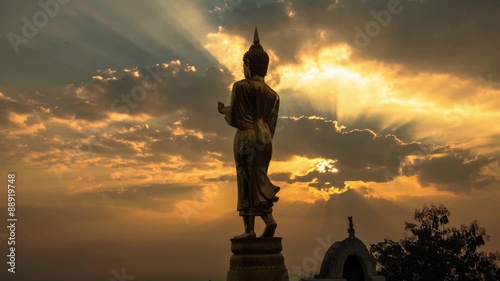HD Timelapse sunrise with golden buddha at Wat Phra That Kao Noi, that built during the 23rd-25th Buddhist centuries. Nan, THAILAND.