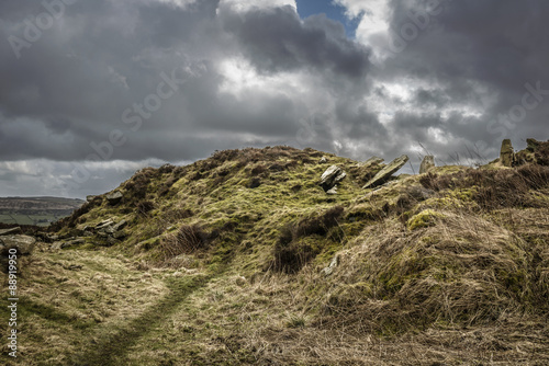 Dramatic landscape of the moors in Yorkshire, England with gloomy, stormy skies.