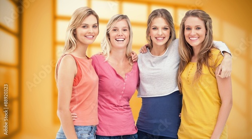 Composite image of four friends standing beside each other 