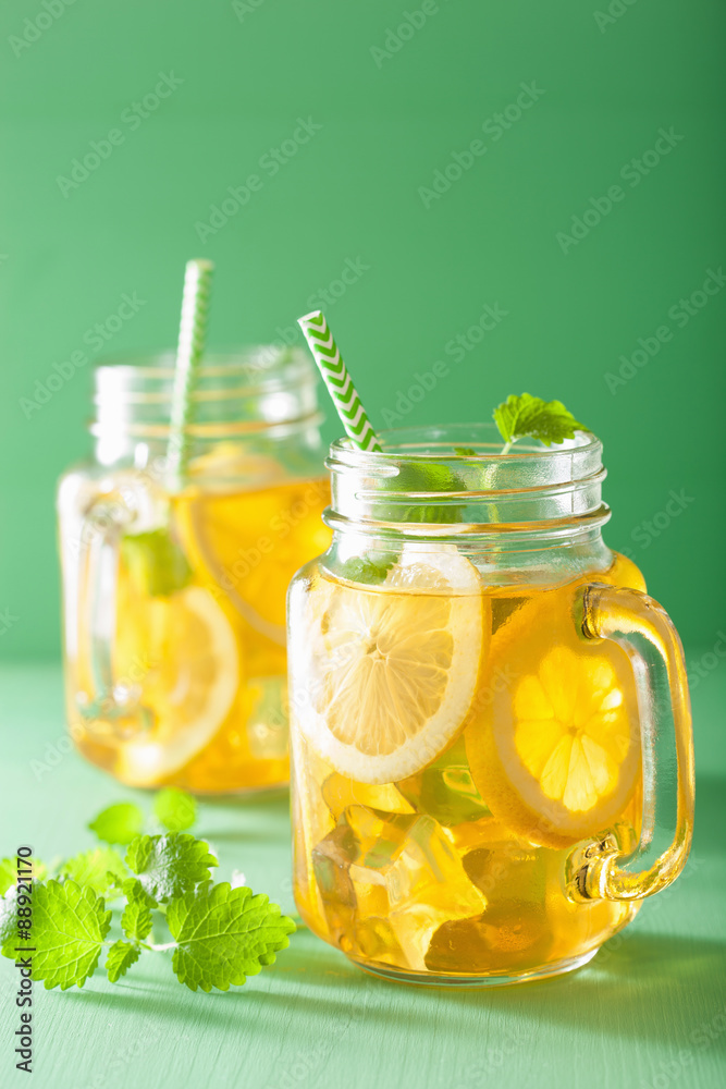 ice tea with lemon and melissa in mason jars ice tea with lemon and melissa in mason jars