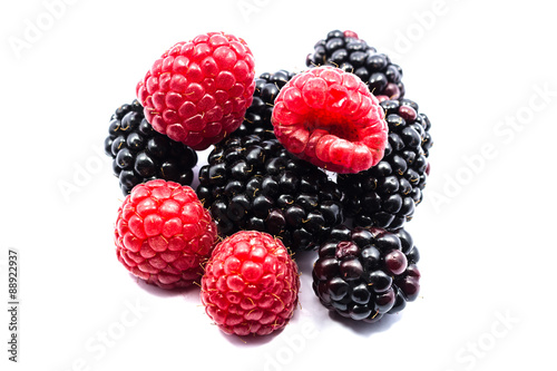 Close up blackberry and raspberry isolated on white background