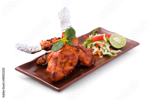 delicious, indian tandoori chicken served with salad