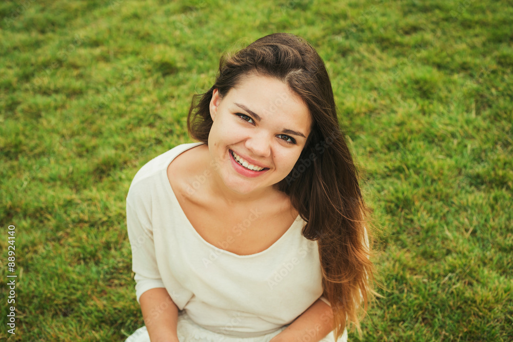 young caucasian female student on campus, student smiling in campus area young caucasian female student on campus, student smiling in campus area