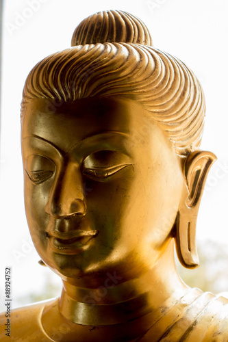Golden buddha statue isolated on white background
