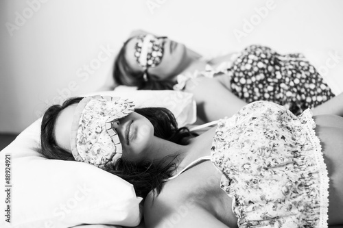 Ttwo beautiful women in the bed photo