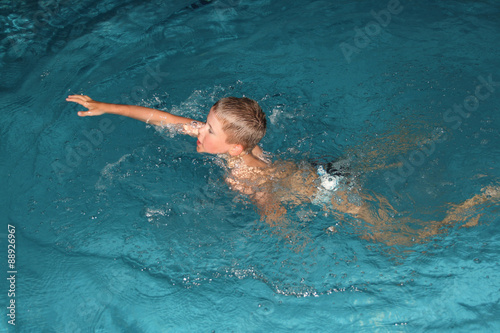 Close up of young boy swimming