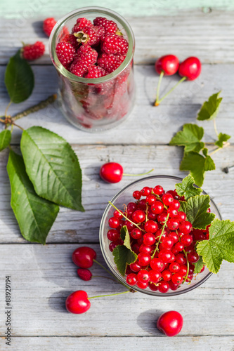 Fruits cherries currants wooden background