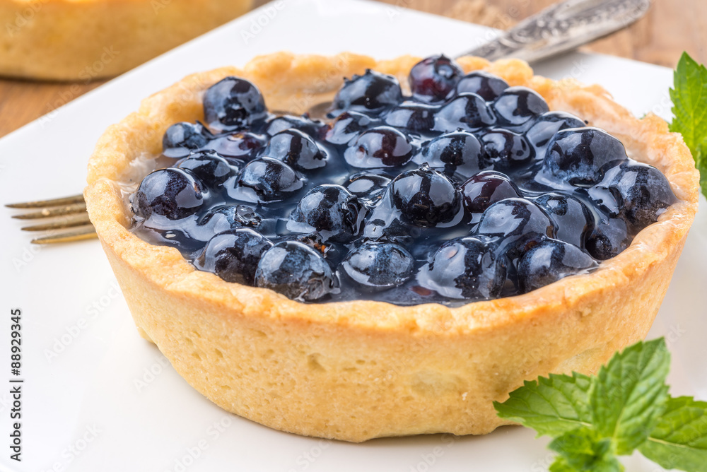fresh blueberries homemade tart on a wooden desk fresh blueberries homemade tart on a wooden desk