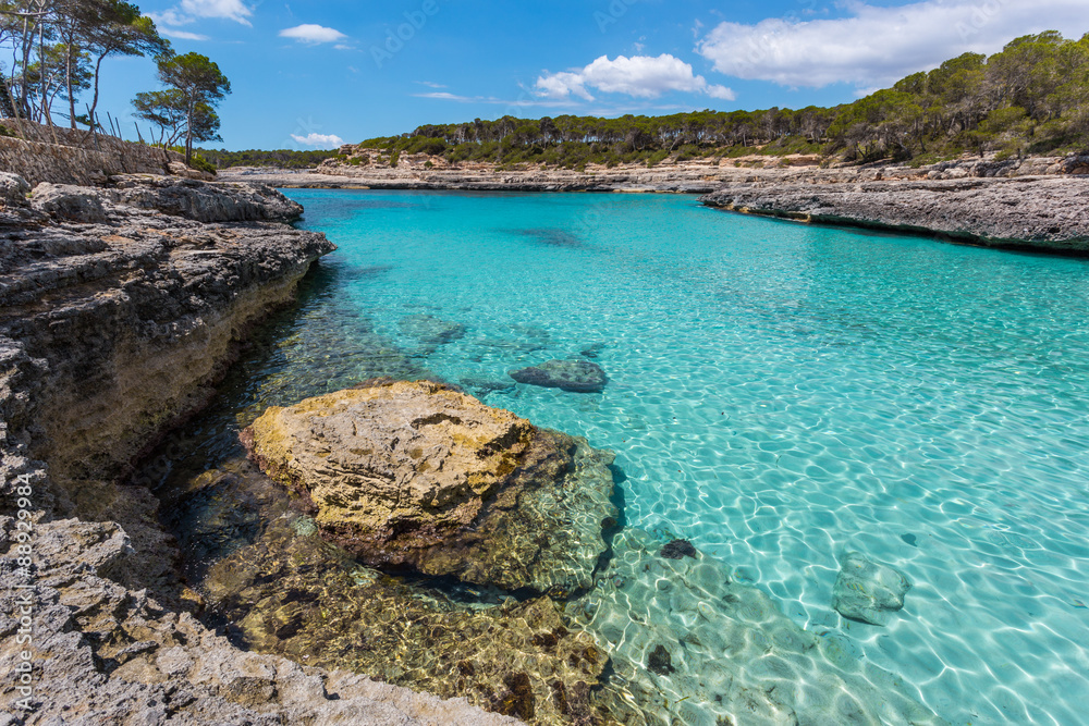 Turquoise waters of a bay in the Mondragó Natural Park, Mallorc
