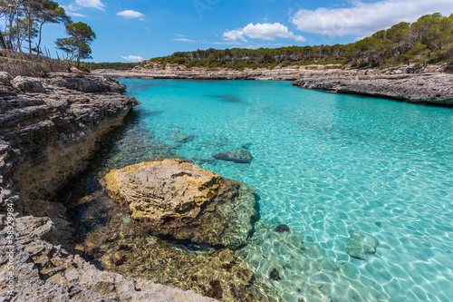 Turquoise waters of a bay in the Mondragó Natural Park, Mallorc