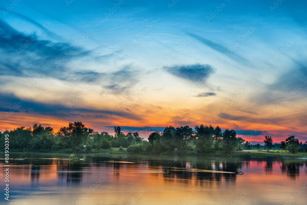 Beautiful sunset above a big river Beautiful sunset above a big river