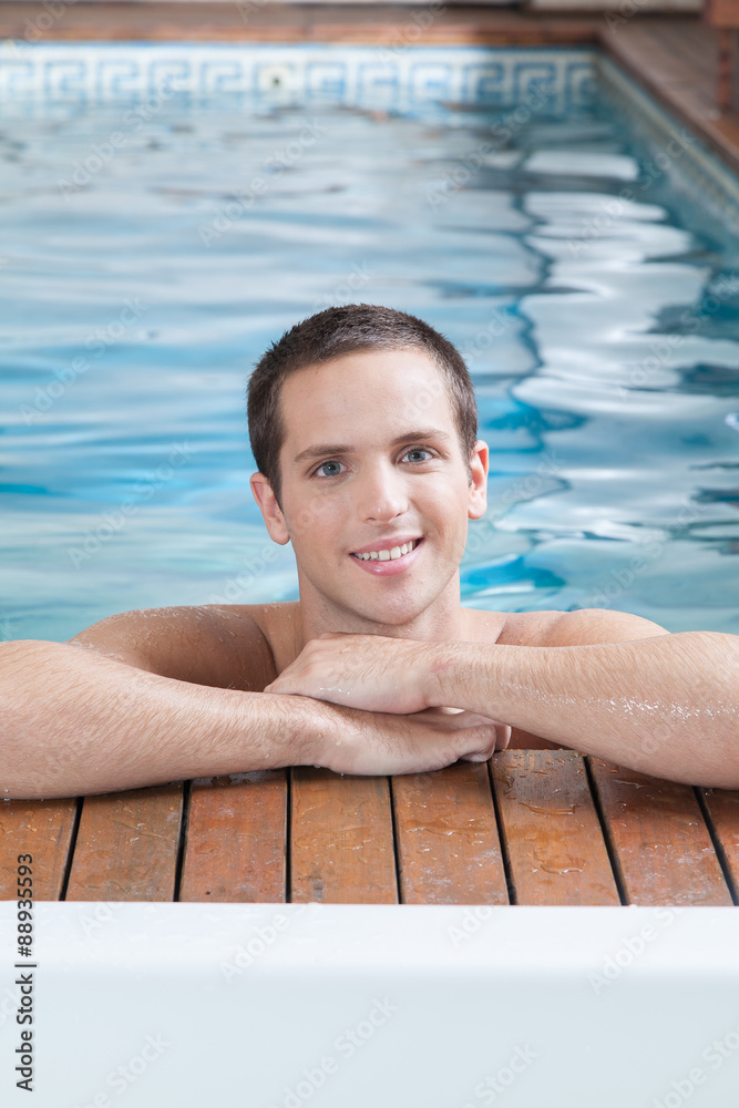 Happy man inside the pool