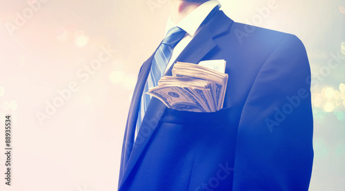 Businessman with wad of cash