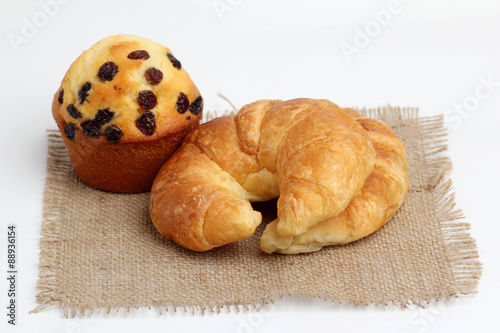 croissant muffin on spuare frayed burlap photo