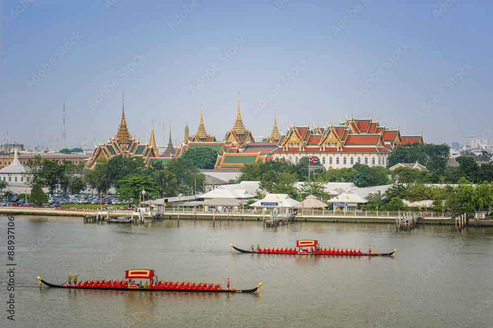 Landscape of Thai's king palace with goldent guard ship on the front.