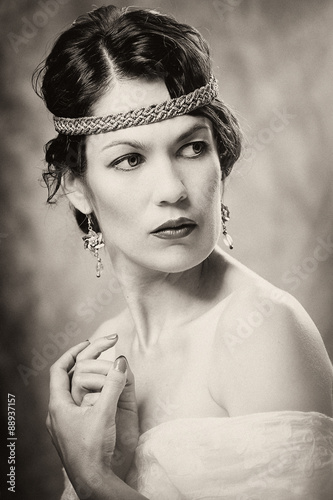 Young girl posing studio black-and-white portrait vintage style
