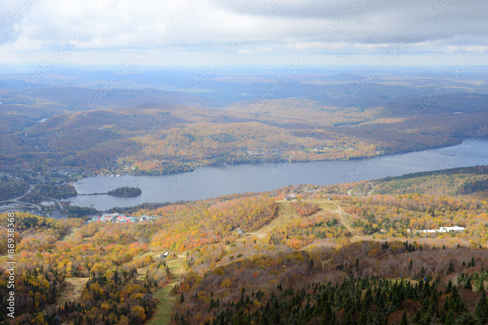 Lake Tremblant and Mont-Tremblant village in fall with fall foliage, from top of Mont Tremblant, Quebec, Canada.