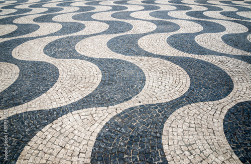 Typical portuguese cobblestone hand-made pavement in Portugal, L