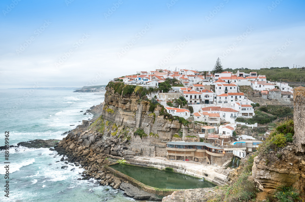 Azenhas do Mar white village landmark on the cliff and Atlantic