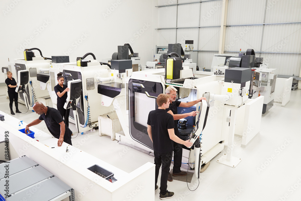 Fototapeta premium High Angle View Of Engineering Workshop With CNC Machines