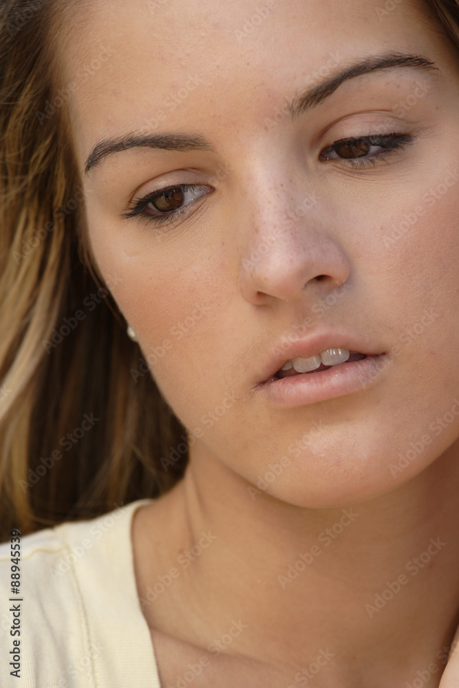 Fototapeta premium Close-up of a young woman in thought.
