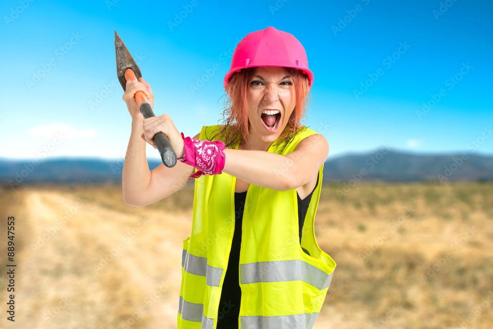 Work woman with ax over white background