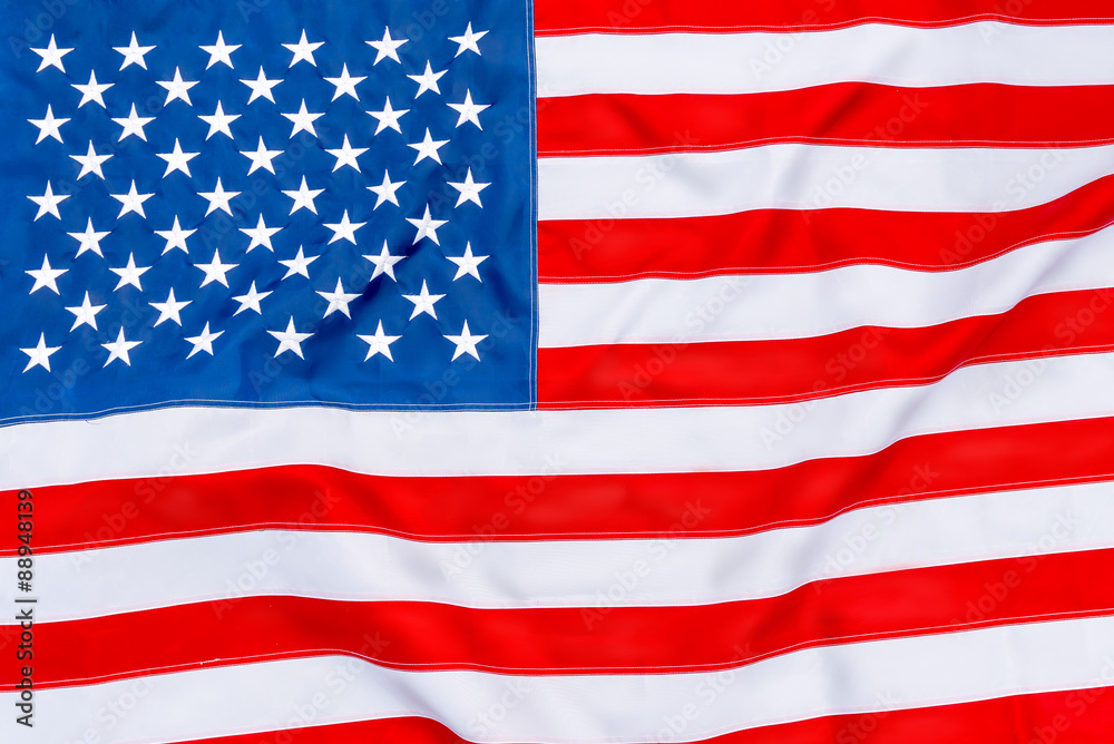 American flag fills the frame completely and fluttering in the w American flag fills the frame completely and fluttering in the w