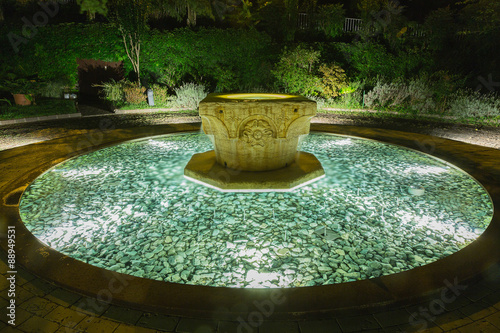 Stone fountain with clear water and lighting system