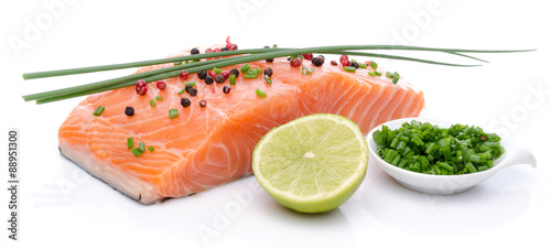 Fresh raw salmon fillet with herbs, lemon and spice