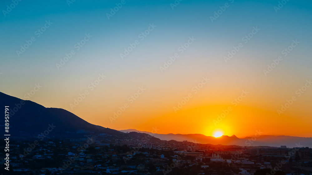 Mountain And Sunset at Mijas, Spain. Dark Silhouette of Mountain