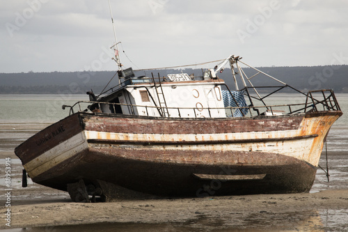 Old boat on the beach in low tide in Inhambane  Mozambique  