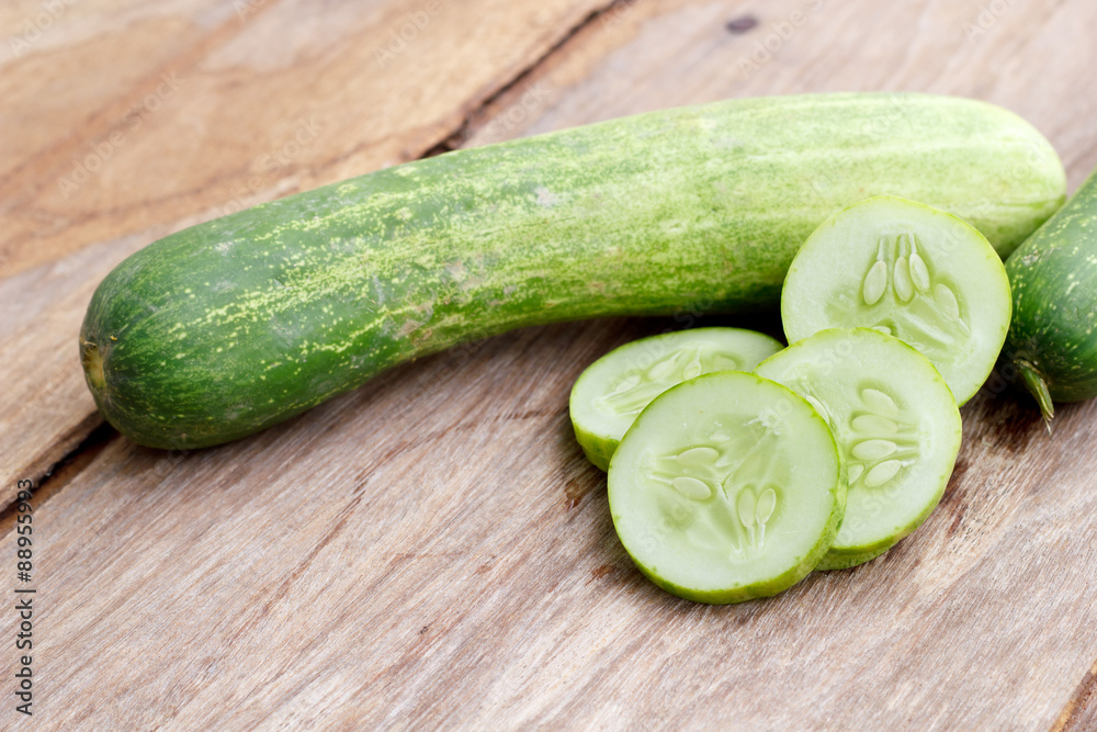 Cucumber isolated on wood background. Cucumber isolated on wood background.