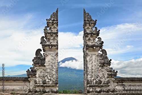 Entrance gate Pintu Bintar to traditional temple Lempuyang on Agung mount background - Bali island symbol. Culture and architecture of Asian people, Indonesian and Balinese landscapes and wallpapers